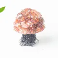 Orange natural crystal mushroom ornament with a dark base for desktop home decoration - Red Agate