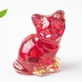 Detail of red resin cat figurine with dried flower petals and gold foil flakes - 3.2cm x 3.3cm x 4cm / Red Glass