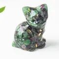 Close-up of cat figurine made of ruby zoisite crystal with gold foil detailing - 3.2cm x 3.3cm x 4cm / Ruby Zoisite