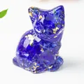 Detail of dark blue resin cat figurine with shimmering gold foil accents on white surface - 3.2cm x 3.3cm x 4cm / Blue Glass