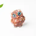 Resin owl figurine with reddish-brown natural crystals and gold foil decorative accents - Red Agate