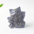 Close-up of black resin lucky cat statue with gold foil accents and a gold coin - Obsidian / 70x60x55mm