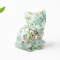 Detailed macro of crystal cat resin figurine with blue stones and gold foil accents - 3.2cm x 3.3cm x 4cm / Amazonite