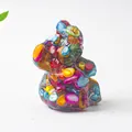 Macro detail of koala crystal resin figurine filled with colorful stones on white background - Colorful Shell