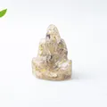 Primer plano de estatua de Ganesha en resina con cristales amarillos decorativa - Cuarzo Rutilado Ganesha