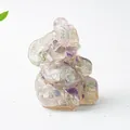 Detailed close-up of elephant resin ornament filled with natural purple crystal gravel - Colorful Fluorite