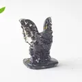 Detailed view of a black resin gargoyle miniature with translucent winged accents - Obsidian