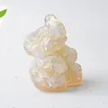 Macro detail of elephant resin figurine with natural crystal stone inlay and glossy finish - Opal