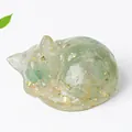 Translucent light green resin sleeping cat figurine with embedded gold foil details - Green Aventurine