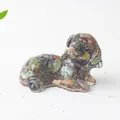 Detailed macro shot of a resin dog figurine filled with colorful natural crystal stones - Ocean Jasper