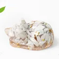 Sleeping cat resin statue with natural white crystals and gold leaf flakes - Howlite