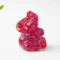 Macro detail of red natural crystal elephant figurine with translucent resin texture - Red Glass