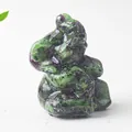 Detailed macro of a Ruby in Zoisite Ganesha elephant figurine with natural stone textures - Ruby Zoisite