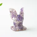 Detailed close-up of a translucent purple amethyst crystal resin dragon figurine on a desk - Dreamy Purple