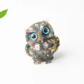 Resin owl figurine with natural blue crystal stones and gold foil on white background - Ocean Jasper