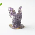 Detailed view of winged monster figurine made of natural purple amethyst crystal stone - Amethyst