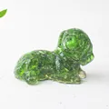 Detail of a green crystal resin dog figurine with sparkling internal crushed stone texture - Emerald Glaze