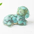 Detailed view of turquoise resin dog figurine with natural crystal stone texture - Turquoise