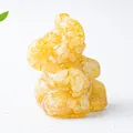 Macro view of crystal elephant figurine made of yellow stones and resin for home decor - Yellow Agate