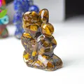 Kneeling fairy figurine made of resin with tiger eye natural crystal stones - Tiger's Eye