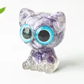 Handmade resin cat figurine featuring purple amethyst crystals and striking blue eyes - Lilac Stone