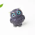Deep purple resin owl figurine with natural crystal gravel and gold foil accents - Blue Goldstone