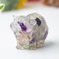 Macro shot of natural crystal cat figurine with purple fluorite texture and polished finish - Colorful Fluorite
