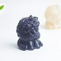 Macro shot of blue sandstone guardian lion figurine with glittering starlight effect - Blue Sandstone