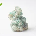 Detailed macro view of an elephant figurine crafted from natural green crystal stone and resin - Amazonite
