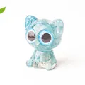 Cute light blue resin cat figurine with large round eyes and crystal stone texture - Aquamarine