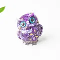 Purple amethyst crystal owl figurine with gold foil and blue eyes on white background - Purple White Speckle