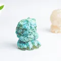 Detailed macro view of an artistic turquoise resin beast statue with natural stone texture - Turquoise