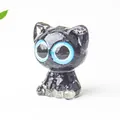 Cute black resin cat figurine with striking blue eyes for home tabletop decoration - Obsidian