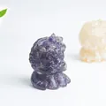 Detailed macro view of purple amethyst crystal lion figurine with intricate carved textures - Amethyst