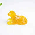 Amber crystal resin puppy figurine in prone position for home office desktop decoration - Citrine