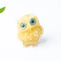 Natural yellow crystal owl ornament with vibrant blue eyes for office desk decor - Topaz