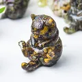 Dettaglio macro di statuetta gatto in pietra occhio di tigre naturale e resina trasparente - Occhio di tigre