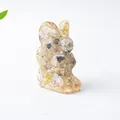 Rabbit figurine made of resin with yellow natural crystal stones for desk decoration - Rutilated Quartz