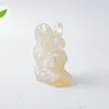 Translucent cream resin rabbit figurine with natural crystal stone textures for decor - Opal