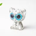 Cute white resin cat figurine with blue eyes and natural crushed crystal stones - Howlite