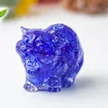 Close-up of a blue crystal resin cat figurine with a detailed roaring expression - Blue Glass