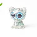 Cute green crystal resin cat figurine with blue eyes and a smooth polished finish - Amazonite