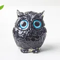 Artistic owl figurine with blue eyes and black feather texture for desk decoration - Obsidian