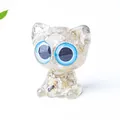 Cute resin cat figurine with golden crystal stones and large blue eyes desk decor - Rutilated Quartz