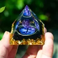 Orgone pyramid with purple crystal ball, black obsidian and gold foil held in hand - Sagittarius / 5cm / 1.97in