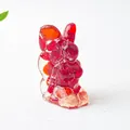 Translucent red resin rabbit fairy figurine with embedded flower petals for home decor - Red Glass