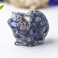 Macro shot of blue crystal resin cat figurine showing detailed angry facial expressions - Lapis Lazuli