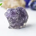 Close-up of a purple amethyst resin cat figurine with natural crystal stone details - Amethyst