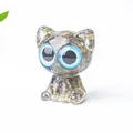 Cute resin cat figurine with large blue eyes and translucent grey mineral texture - Labradorite