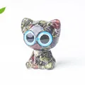 Cat resin figurine with natural red and green crystals and big blue cartoon eyes - Dragon Blood Stone